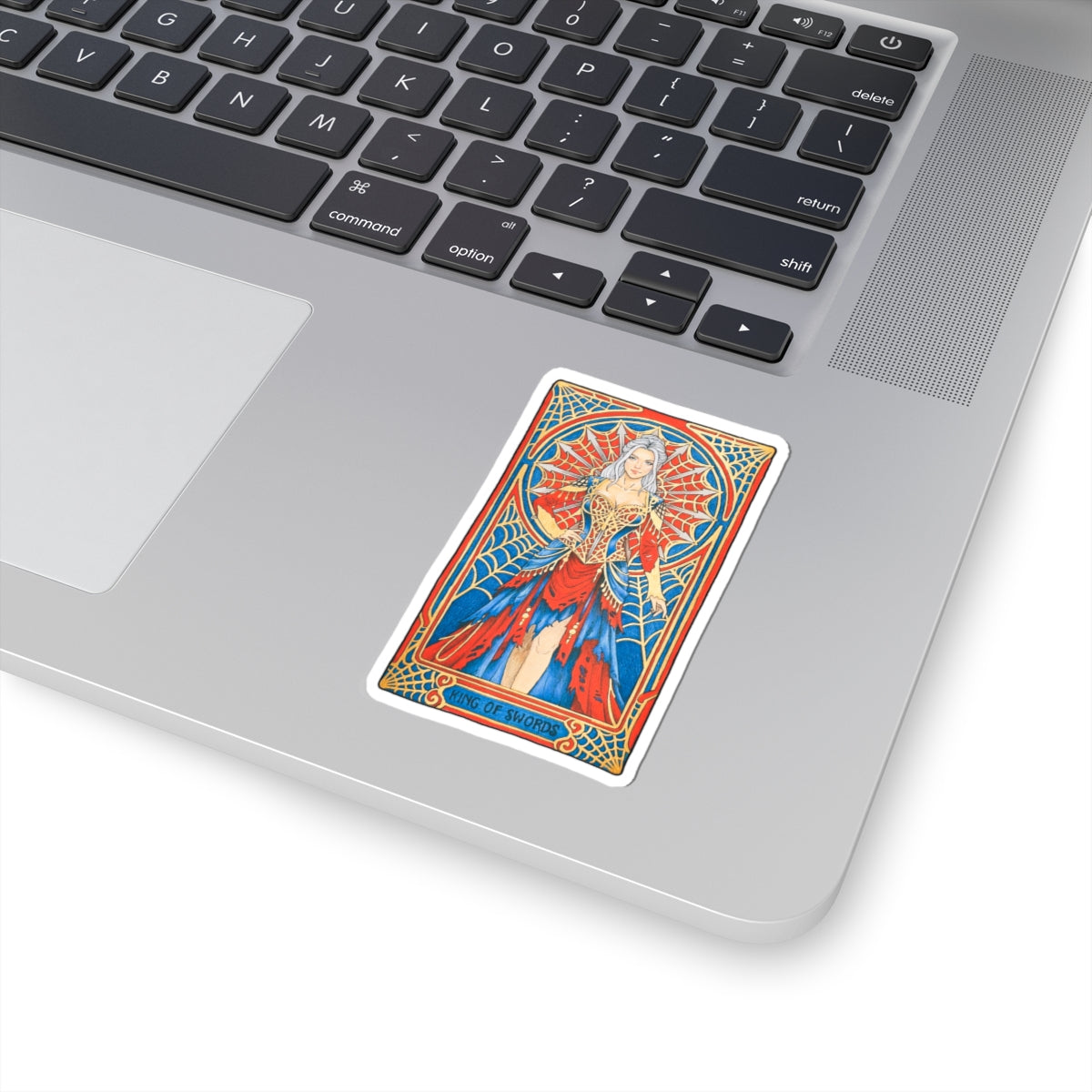 King of Swords tarot kiss-cut sticker: silver-haired figure in a red and blue gown with a spiderweb halo