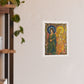 Sun and Moon Saints poster print: two haloed saints in green and gold robes framed by peacocks and lilies