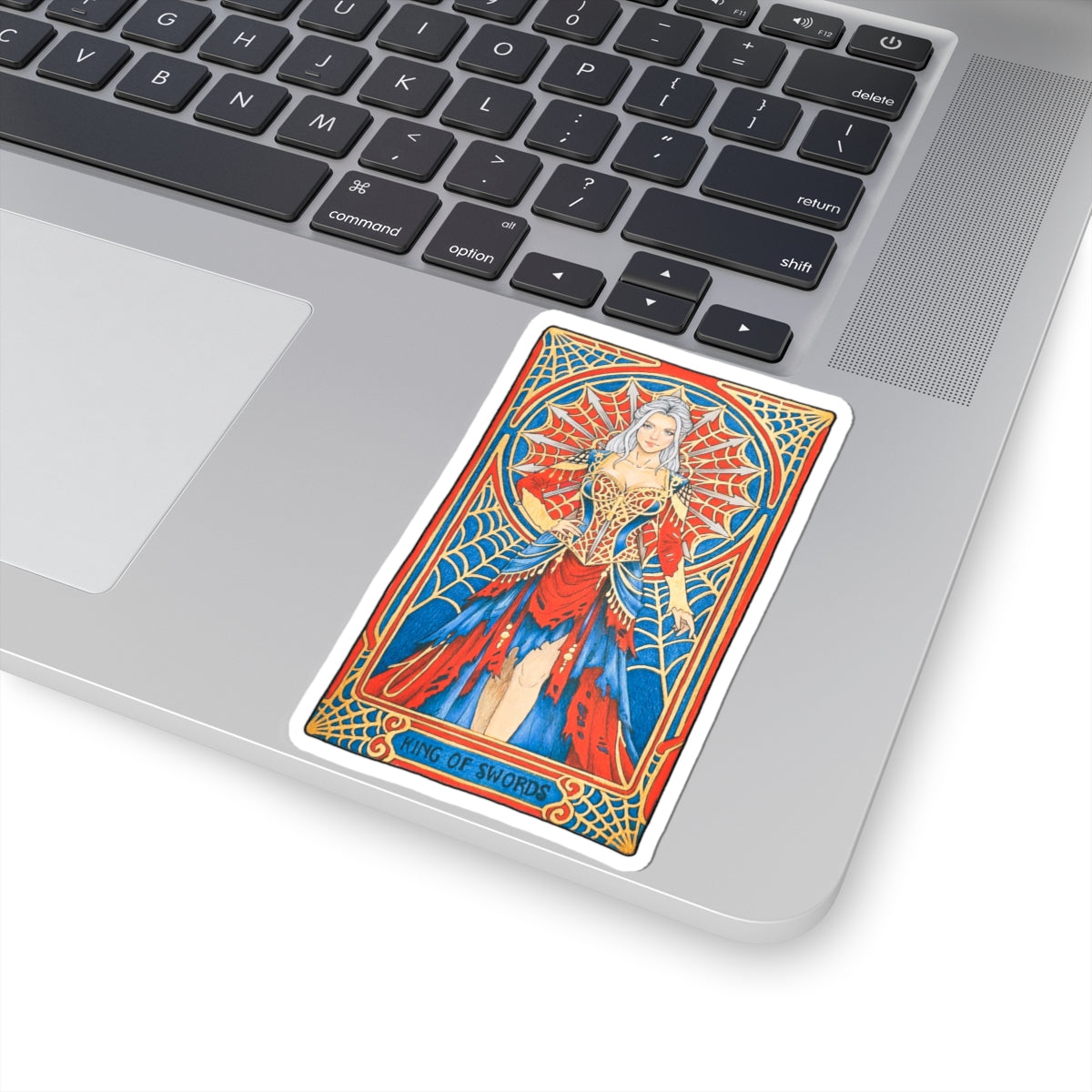 King of Swords tarot kiss-cut sticker: silver-haired figure in a red and blue gown with a spiderweb halo