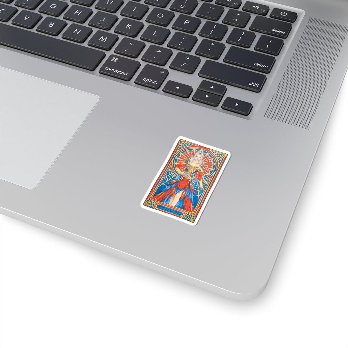 King of Swords tarot kiss-cut sticker: silver-haired figure in a red and blue gown with a spiderweb halo